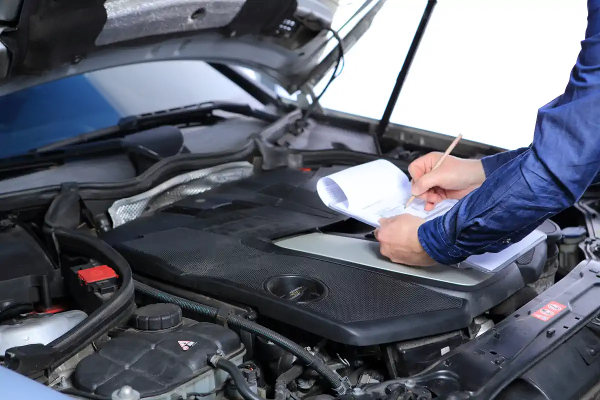 man inspecting vehicle for title loan
