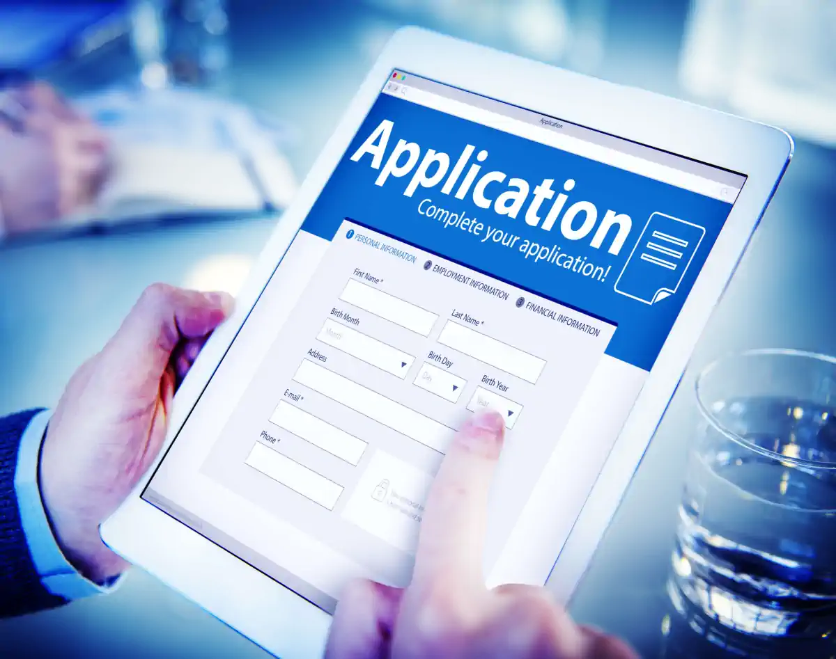 man filling out online title loan application